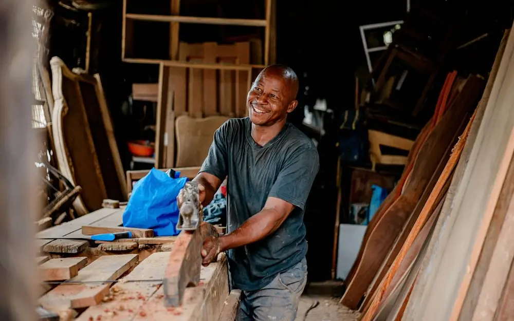 A carpenter at work in a small Texas workshop